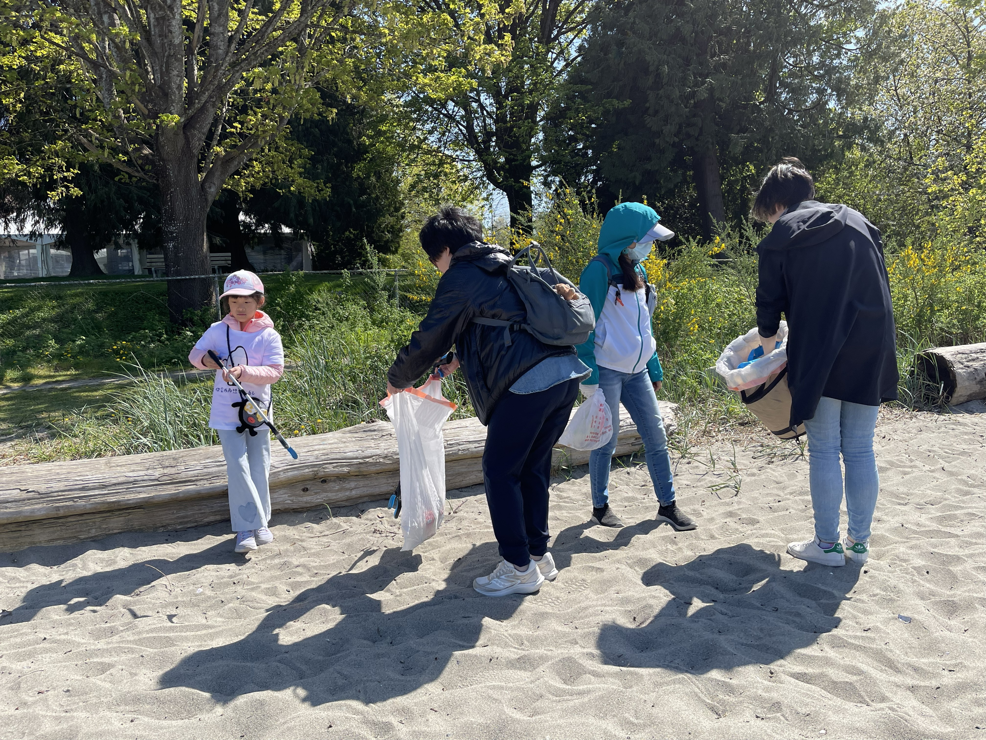 Community members taking part in a shoreline cleanup.